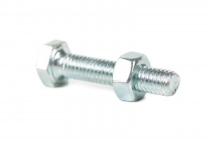 Closeup view of screw bolt with nut over white background